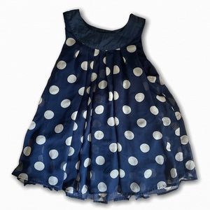 Small women’s blue blouse with white polka dots